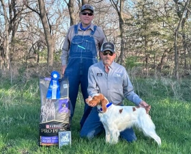 Ghost posing with her prizes and trainer